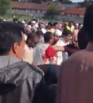 Footage of the aftermath shows a man in a blood-soaked shirt among crowds