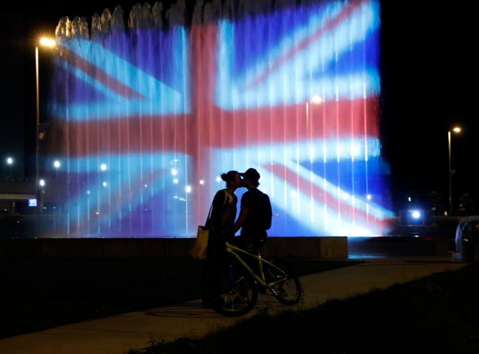  Couple kiss in front of Union Jack projected on a fountain in Zagreb, Croatia