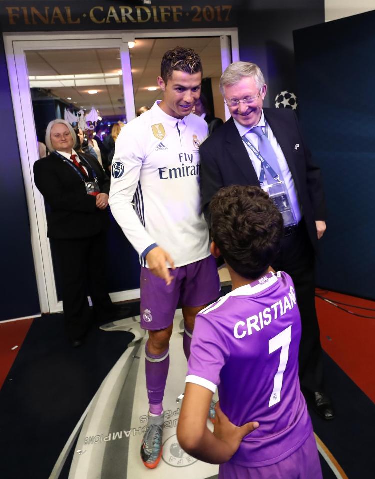  Cristiano Ronaldo and his son Cristiano Jr greet Fergie