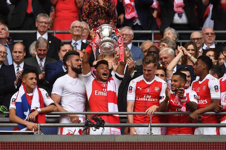  Alex Oxlade-Chamberlain lifts the FA Cup as Arsenal enjoy a record 13th win in the competition