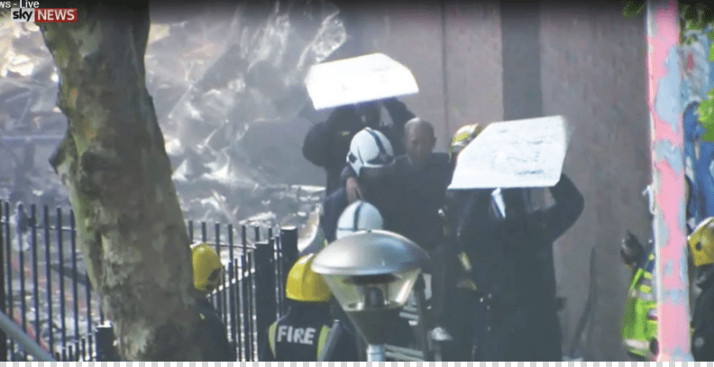  A resident was carried from the debris by firefighters in dramatic footage captured by Sky News