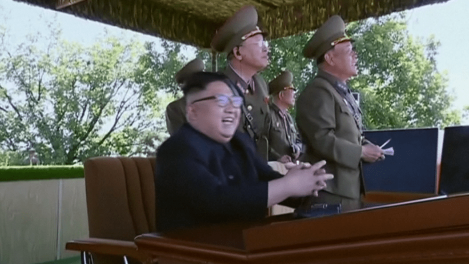  Kim Jong-un laughs as his fighter jets practise bombing land targets