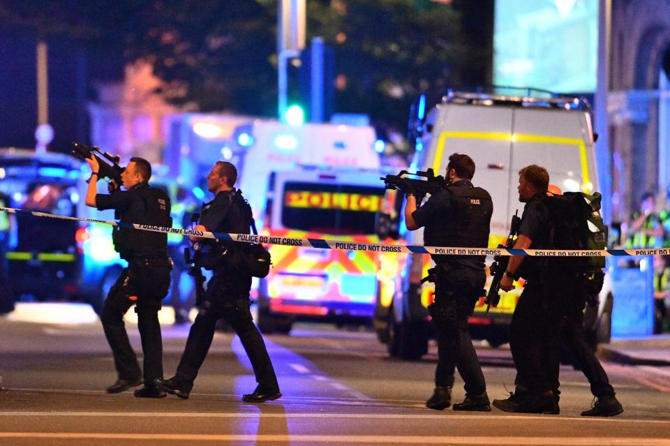  Cops pictured dramatically pointing guns in the air in central London following the deadly terror attack