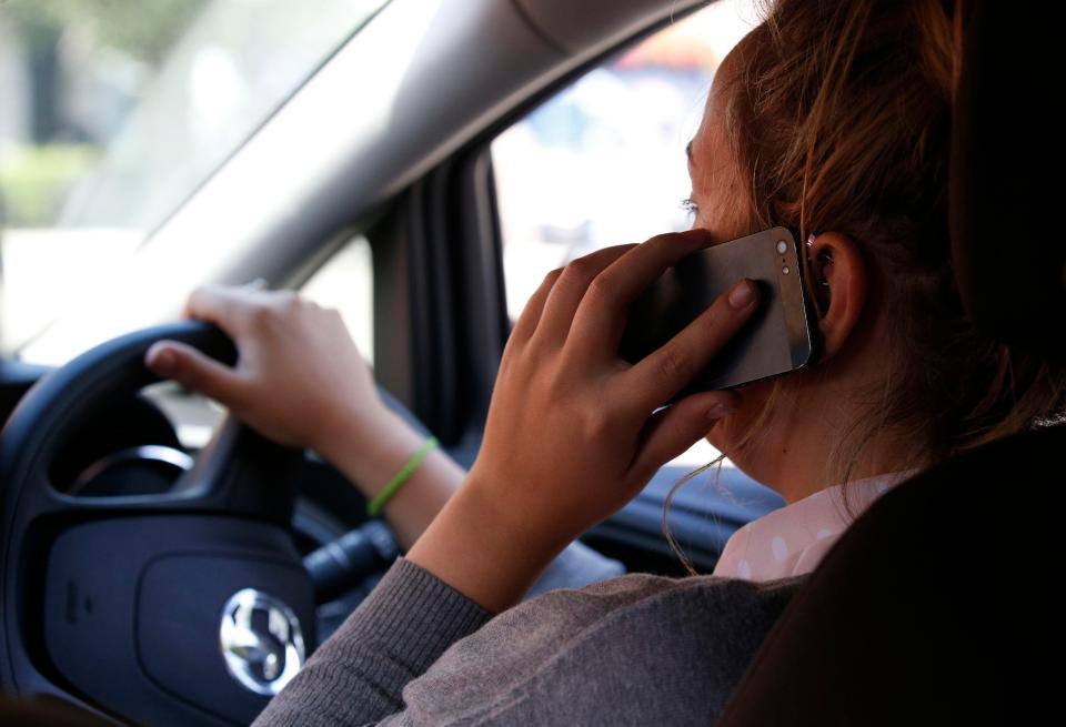  A survey has found that one in five Brits use their mobile phones behind the wheel