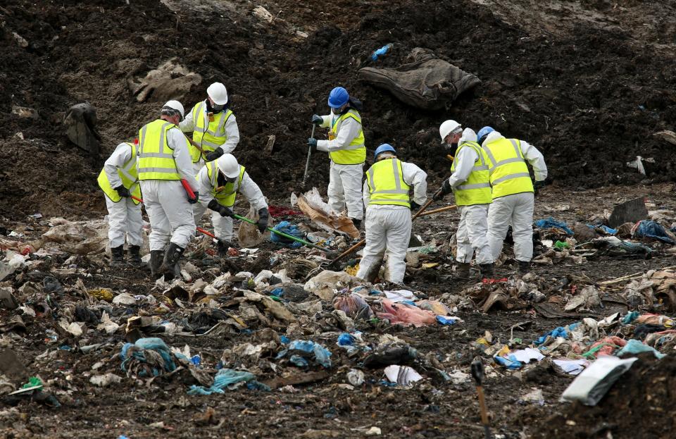  Experts search through rubbish at the landfill site in March