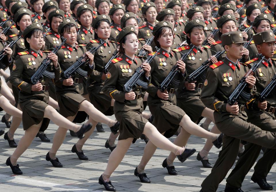  North Korean female soldiers march across Kim Il Sung Square during a military parade