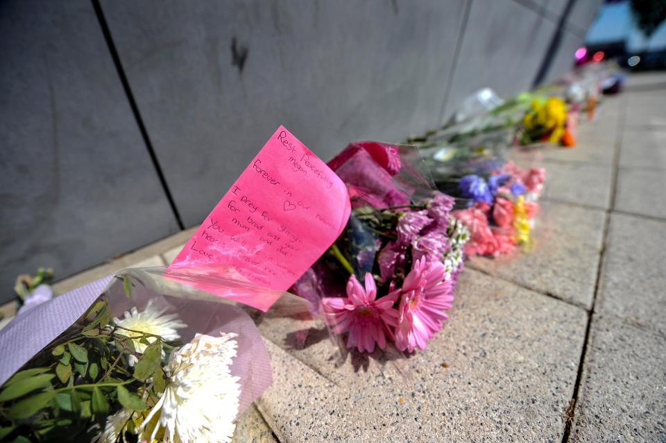  Floral tributes outside Halewood Academy in Liverpool where Megan had attended school