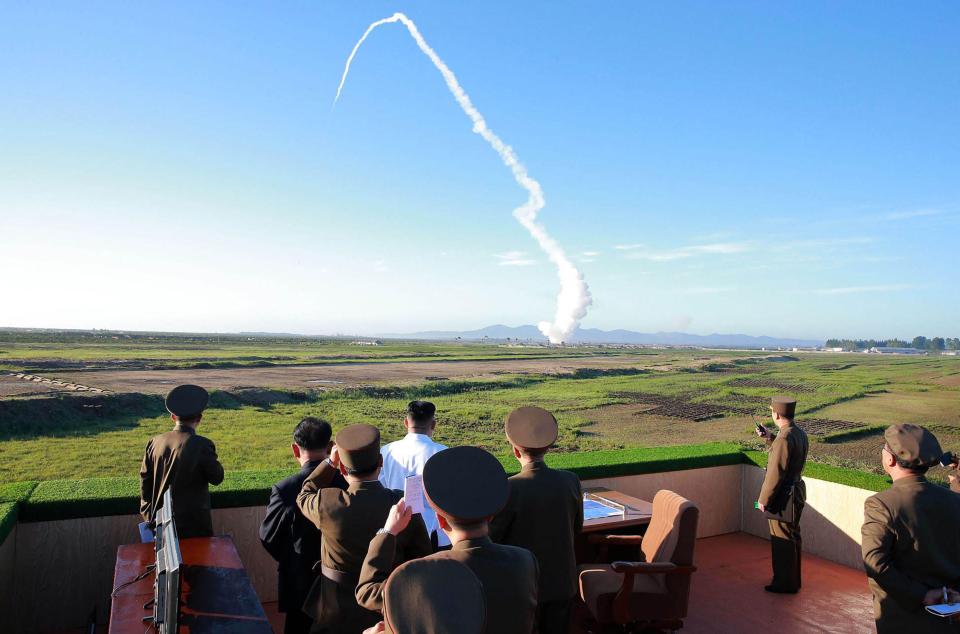  Kim watches the test of a new anti-aircraft guided weapon system