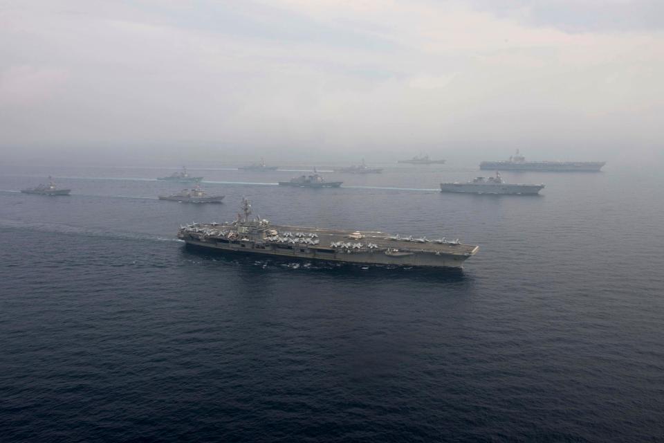  USS Ronald Reagan, front, and USS Carl Vinson, right rear, were seen sailing side by side in the Sea of Japan along with their carrier strike groups in June