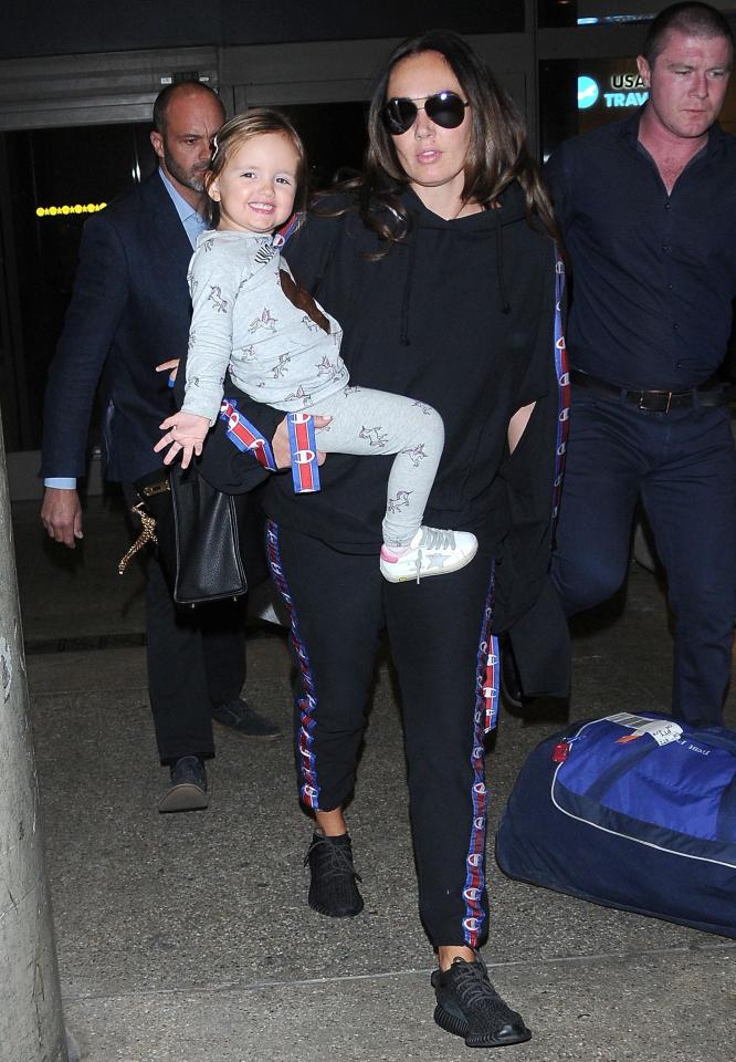  Tamara Ecclestone, wearing Champion at LAX with daughter Sophia