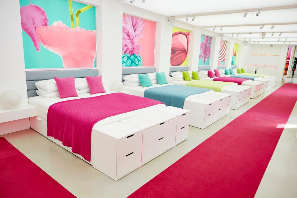  The contestants curl up in double beds all placed close together for extra intimacy - and the colourful room is decked out in cushions