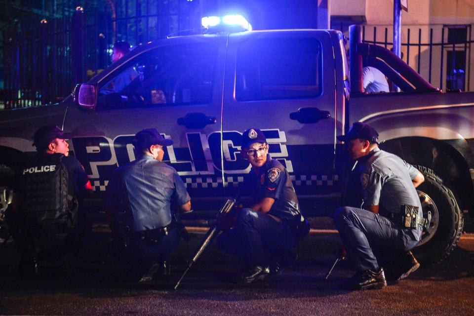  Police are in the area after heavily armed men wearing black hoods stormed the complex at midnight