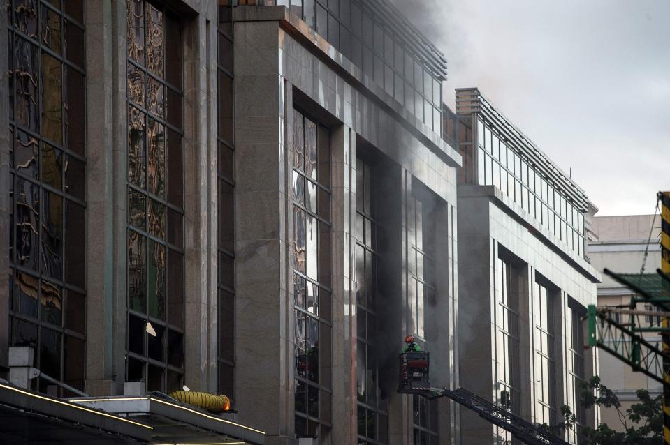  Smoke continued to pour from the the hotel this morning as daylight broke