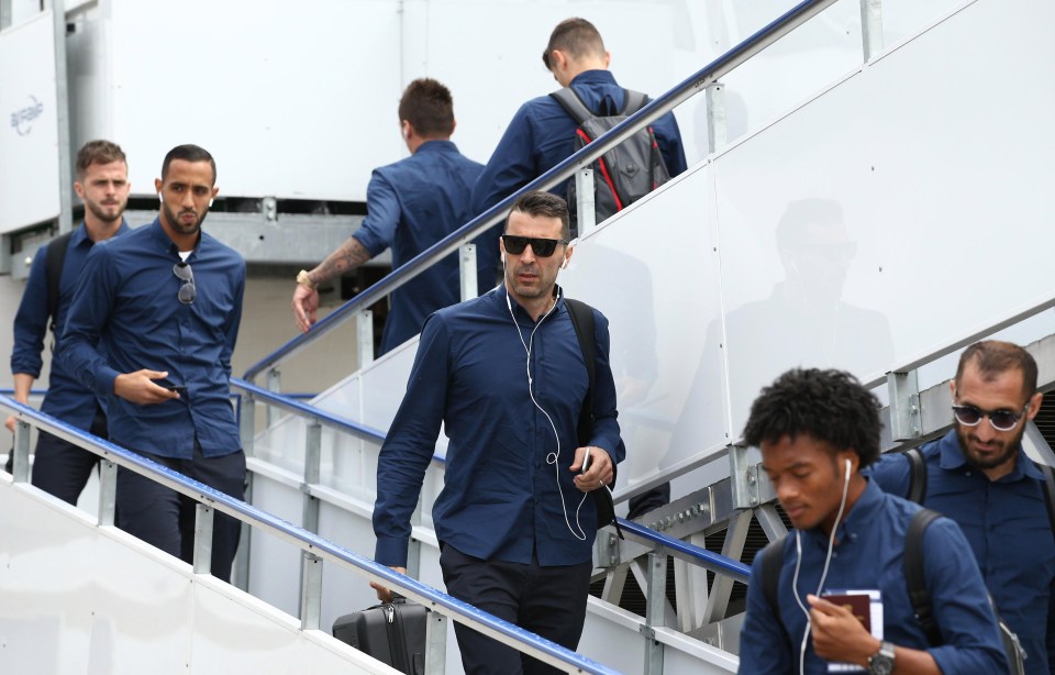 Gianluigi Buffon and the Juventus players descend the ramp at Cardiff Airport as the players head towards their hotel