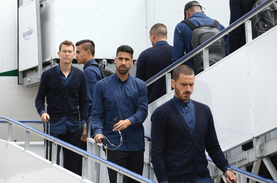 Leonardo Bonucci and Sami Khedira walk off Juventus' plane at Cardiff Airport