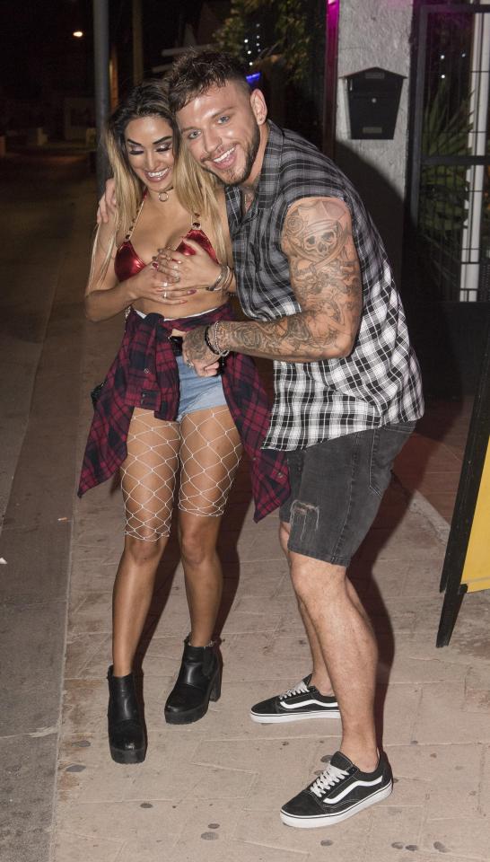  The pair couldn't stop grinning as they left a bar in Ibiza