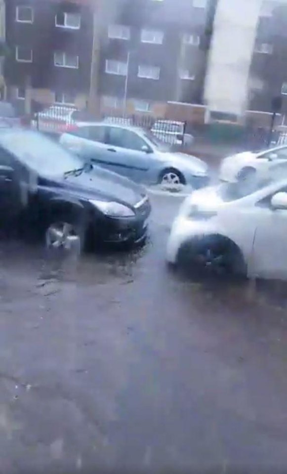 Flash flooding has hit parts of the South East as torrential rain lashes Britain