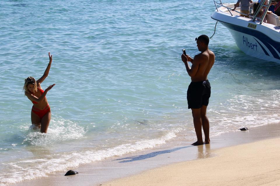  Don't look... Anthony Martial snaps away but Melanie tries to dodge the camera