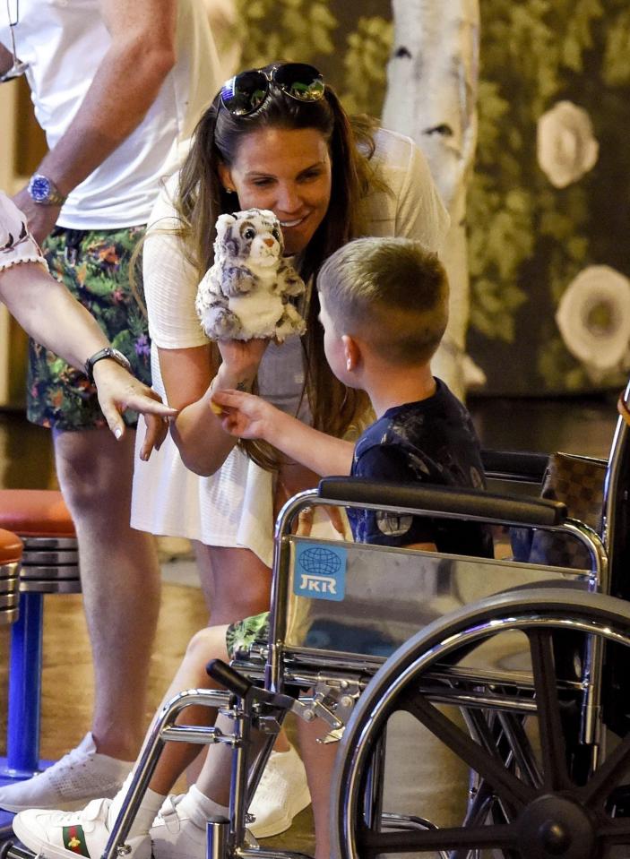  The doting mum allowed her young sons to take a rest in her wheelchair