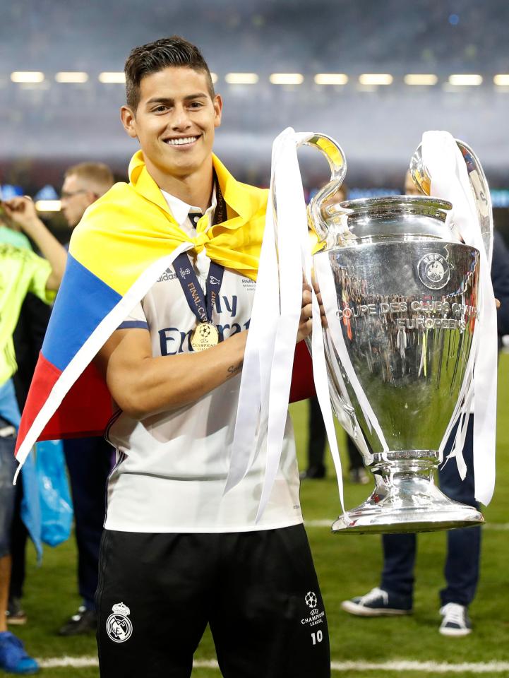  James Rodriguez posed with the trophy after failing to make the squad