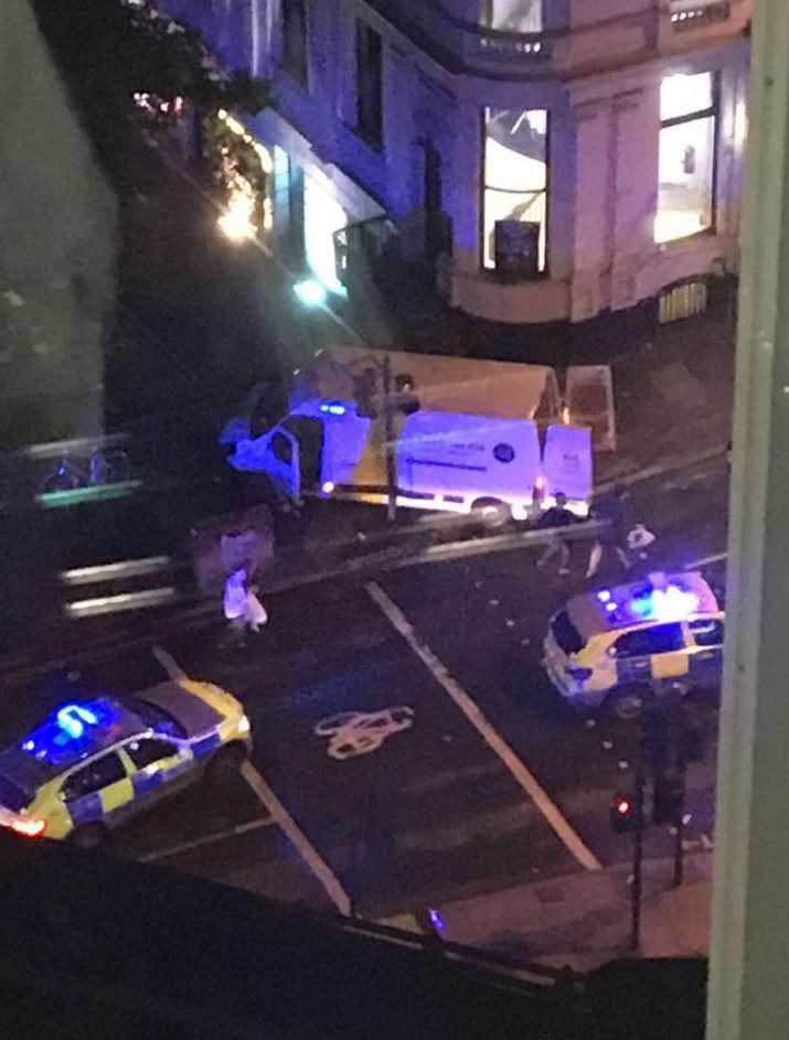 The white van responsible for the ‘attack’ surrounded by multiple police vehicles