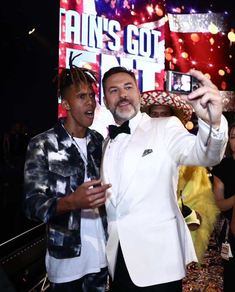 Judge David Walliams posing with the Britain's Got Talent winner 