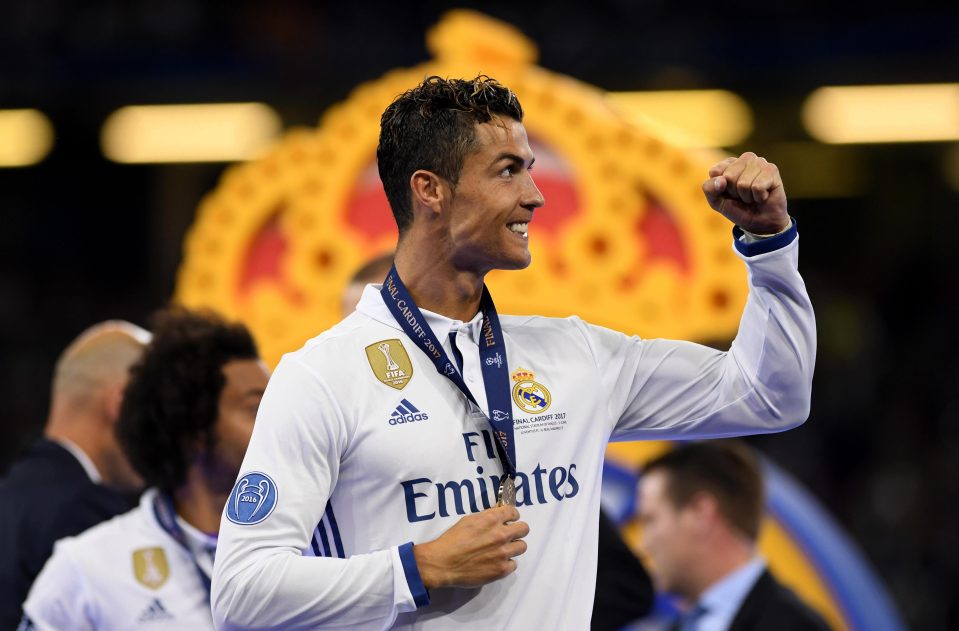  Cristiano Ronaldo fist pumped the air with his medal around his neck