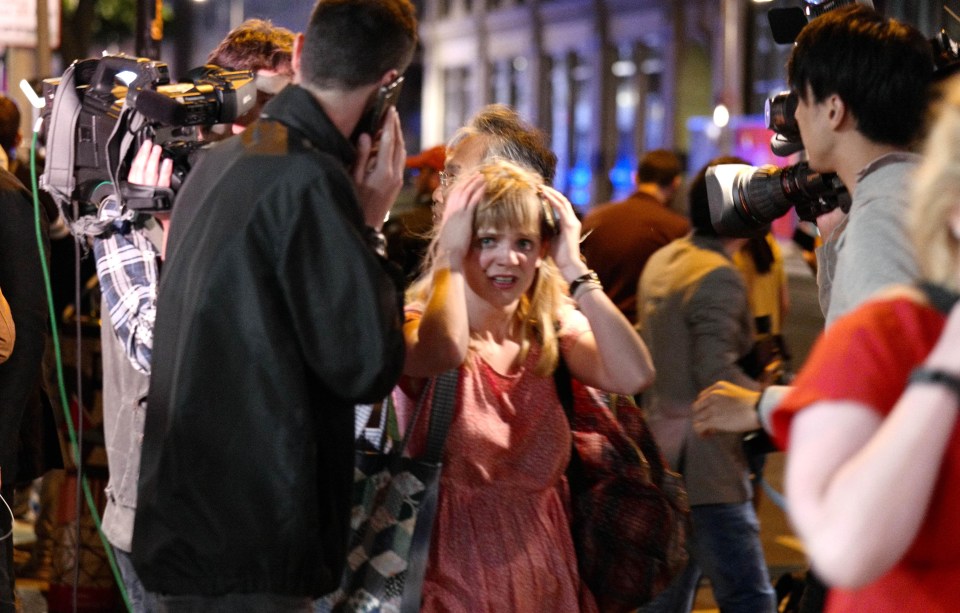 Terrified Londoners put their hands above their heads