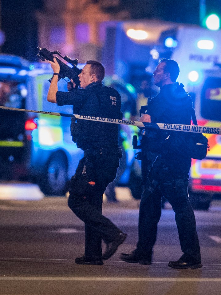 Armed police are seen near London Bridge after reports of an incident involving a vehicle and pedestrians