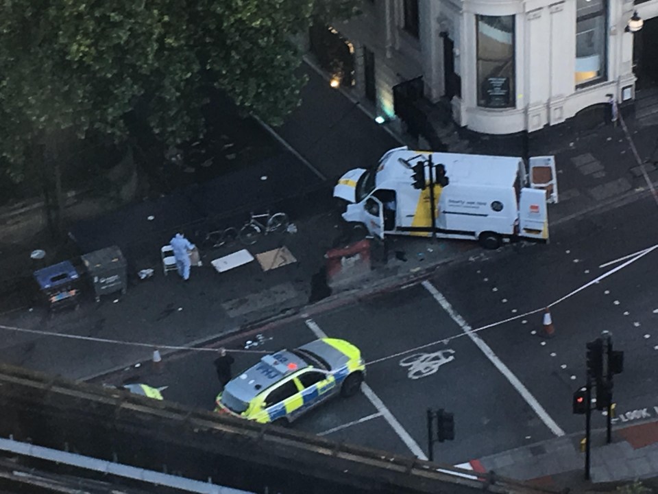 Cops pictured at the scene of the attack where their B&Q and Hertz vehicle is seen abandoned