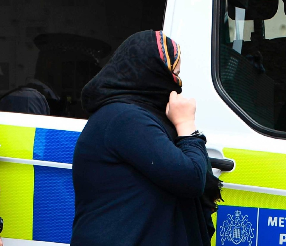 Arrest 4 . . . final woman nicked tries to hide her face 