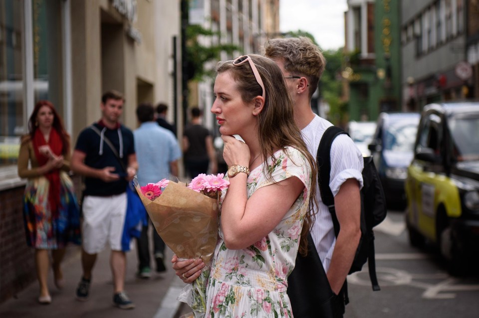 Londoners return to the area of last night's attacks to lay flowers