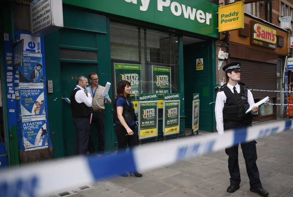 Flats above a number of shops were raided as police swarmed on the area in East Ham