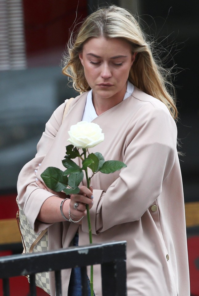 Sombre Londoners have been taking flowers to the scene of the attack