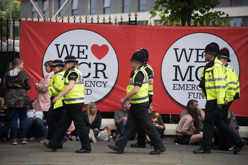  Lines of police march around the venue as people queued up to enter