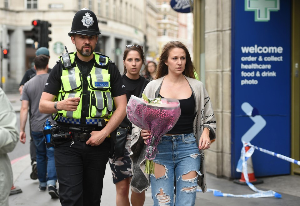 Floral tributes started to be left close to the scene in London Bridge on Sunday