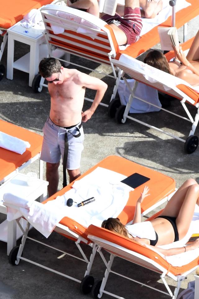  A shirtless Noel basking in the Italian sun