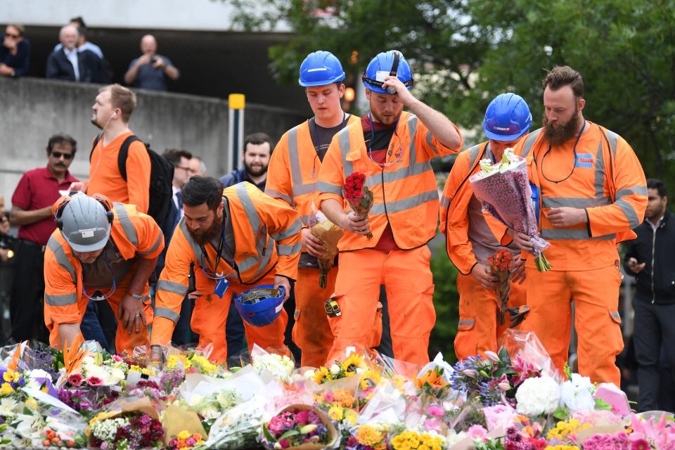  Construction workers pay their respects to the fallen