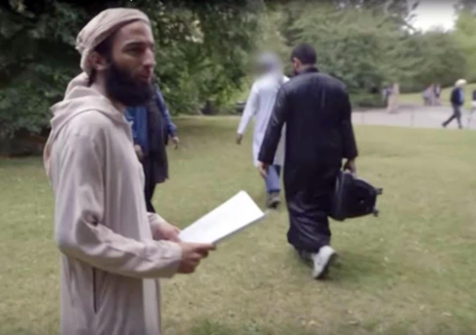  Abz pictured here turning to the camera after posing with the jihadi flag in the park