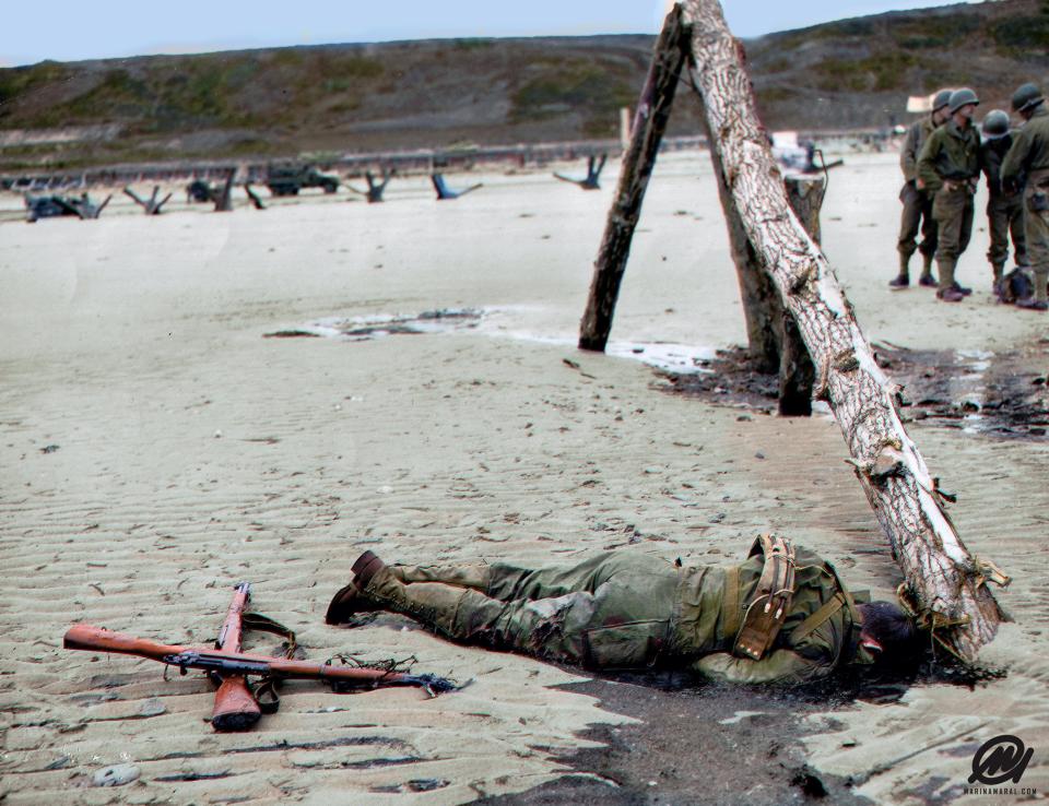  The corpse of a US soldiers lays on Omaha Beach in Normandy. The D Day landings were one of the most decisive moments of World War II and marked the moment the Allied forces began to retake territory from the Nazis