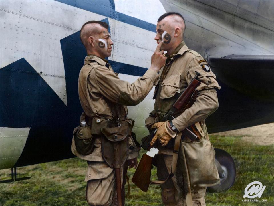  Soldiers Clarence Ware and Charles Plaudo of the 101st Airborne Division apply war paint, with the inspiration coming from their unit sergeant Jake McNiece, who was part Chocataw