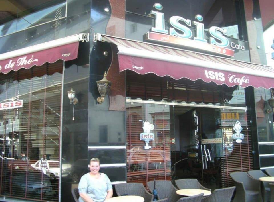  Redouane's bride Charisse poses for joke photo outside a Casablanca cafe with same name as terror group ISIS in February 2014