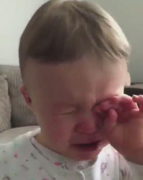  The tot can't contain her tears when the emotional song begins