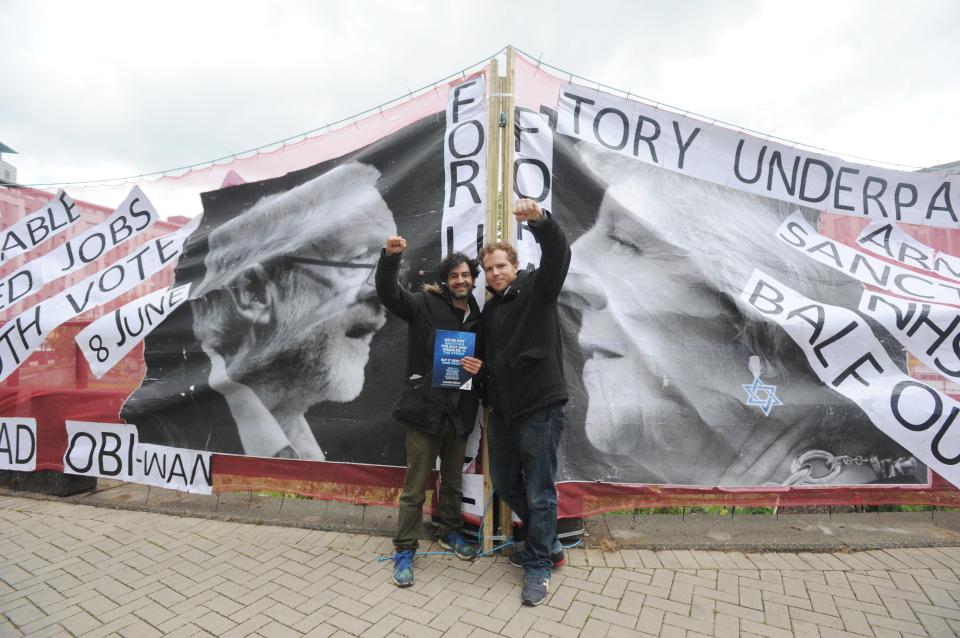  Activists Nima Matserson and Matt Viney celebrate unveiling the new posters