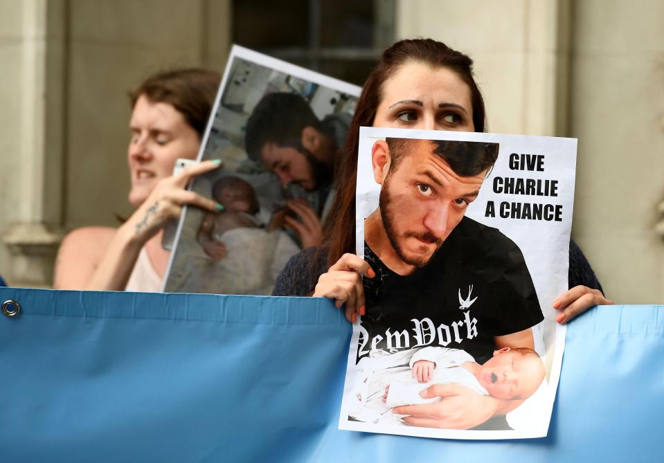  Demonstrators with placards called on the court to 'give Charlie a chance'