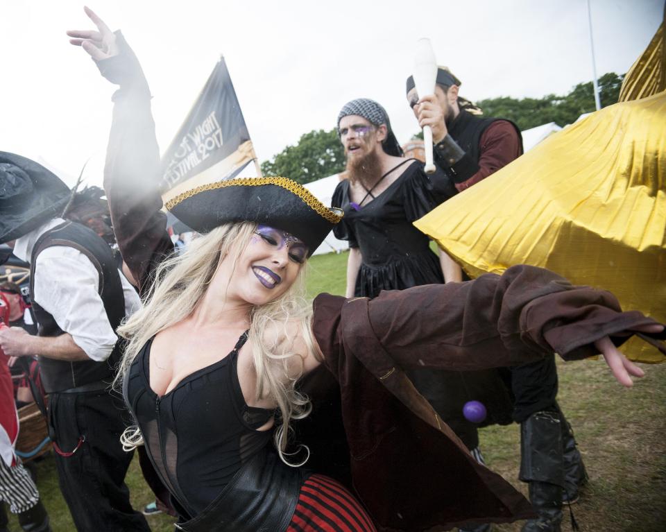  This young woman showed off her elaborate purple make-up as she danced at the festival in Seaclose Park