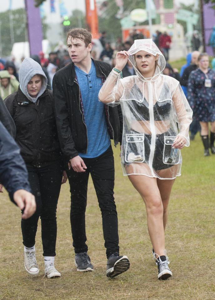  This woman's see-through rain jacket meant she could still show off her festival-wear