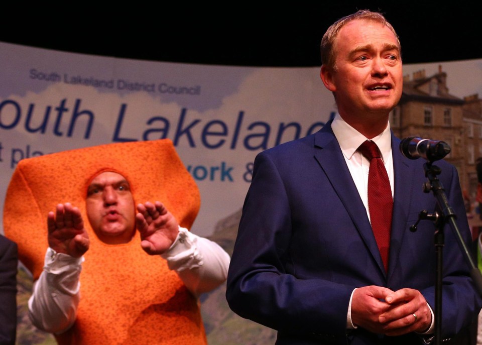 Tim Farron with novelty candidate Mr Fish Finger in the background during the General Election count