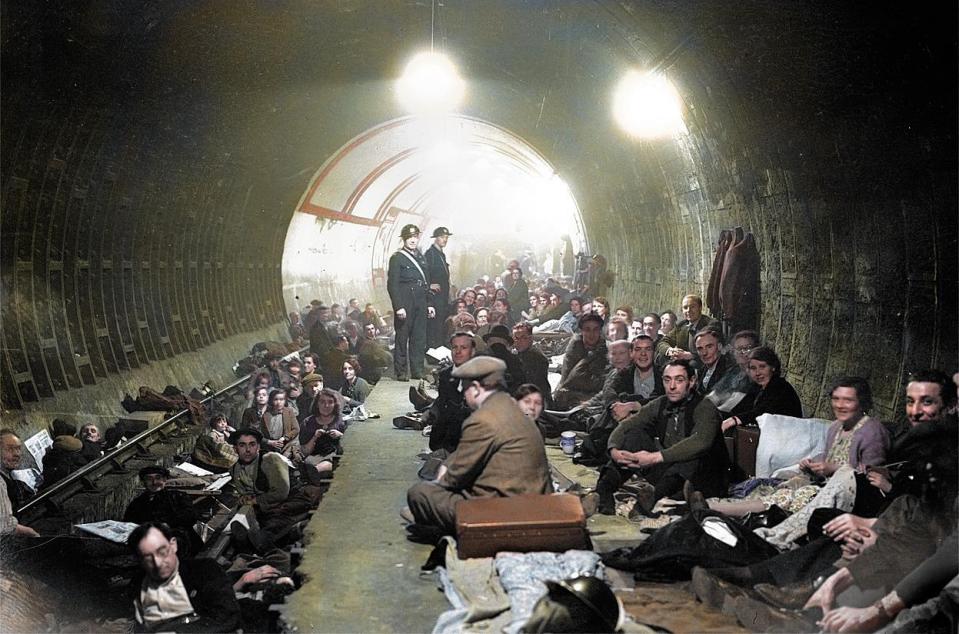  1940: Men gather together in Aldwych air raid shelter. The tube station was used as a bunker during the Blitz and kept thousands of Brits safe.