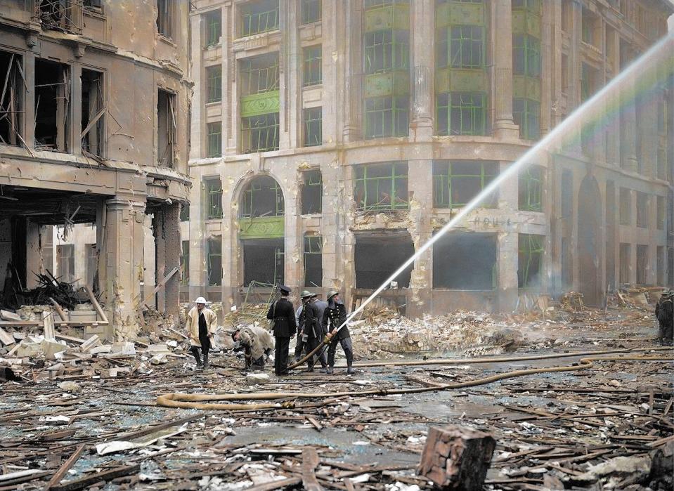  September 9, 1940: Firemen attend the rubble-covered site of London Bridge and spray water on burning buildings. The area was struck by a series of air raids the previous weekend.